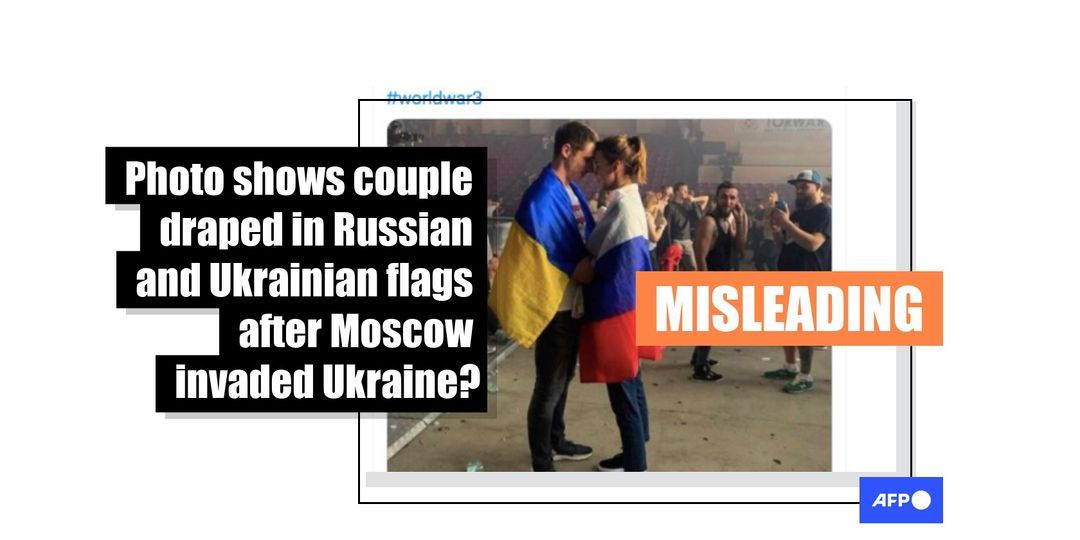 Photo of couple draped in Russian and Ukrainian flags has circulated online since 2019 - Featured image